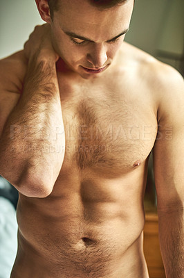 Buy stock photo Cropped shot of a young handsome shirtless man in his bedroom at home