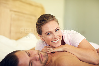 Buy stock photo Cropped shot of a young attractive wife lying on her husband's chest in bed at home