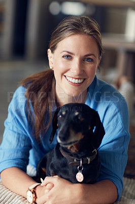 Buy stock photo Portrait of a young attractive woman spending the day with her pet at home