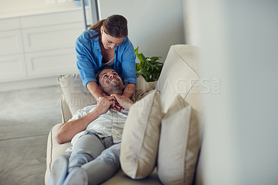 Buy stock photo Cropped shot of a young married couple spending the day at home
