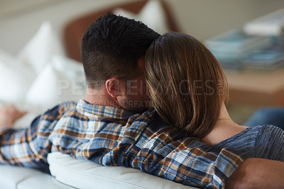 Buy stock photo Rearview shot of an unrecognizable married couple spending the day at home