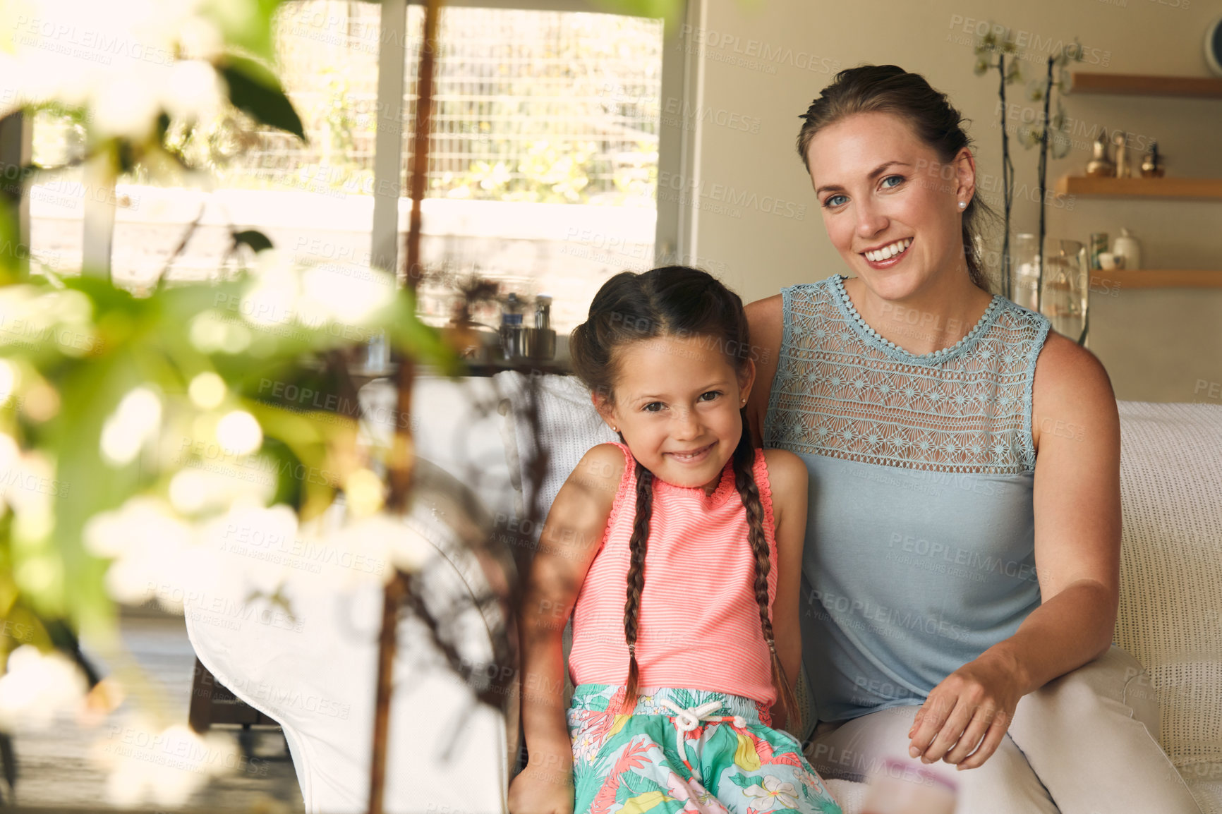 Buy stock photo Cropped shot of a mother and daughter spending time together at home