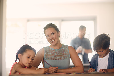 Buy stock photo Shot of a woman bonding with her children