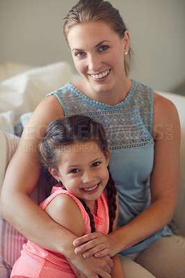 Buy stock photo Cropped shot of a mother and daughter spending time together at home
