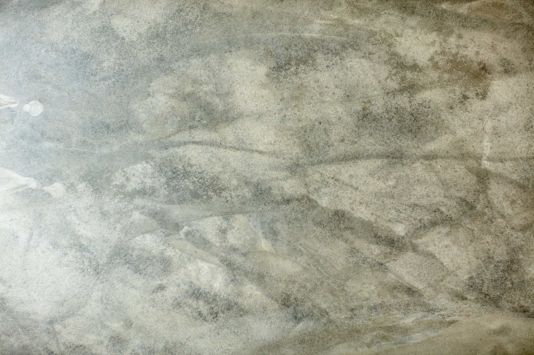Buy stock photo High angle view of a weathered concrete floor with copy space. Hard ground or wall with a rough surface useful as a background inside a building. Closeup of a grey solid exterior