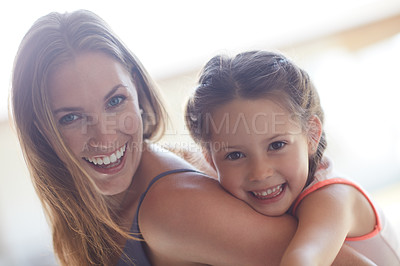 Buy stock photo Cropped shot of a mother and daughter spending time together at home