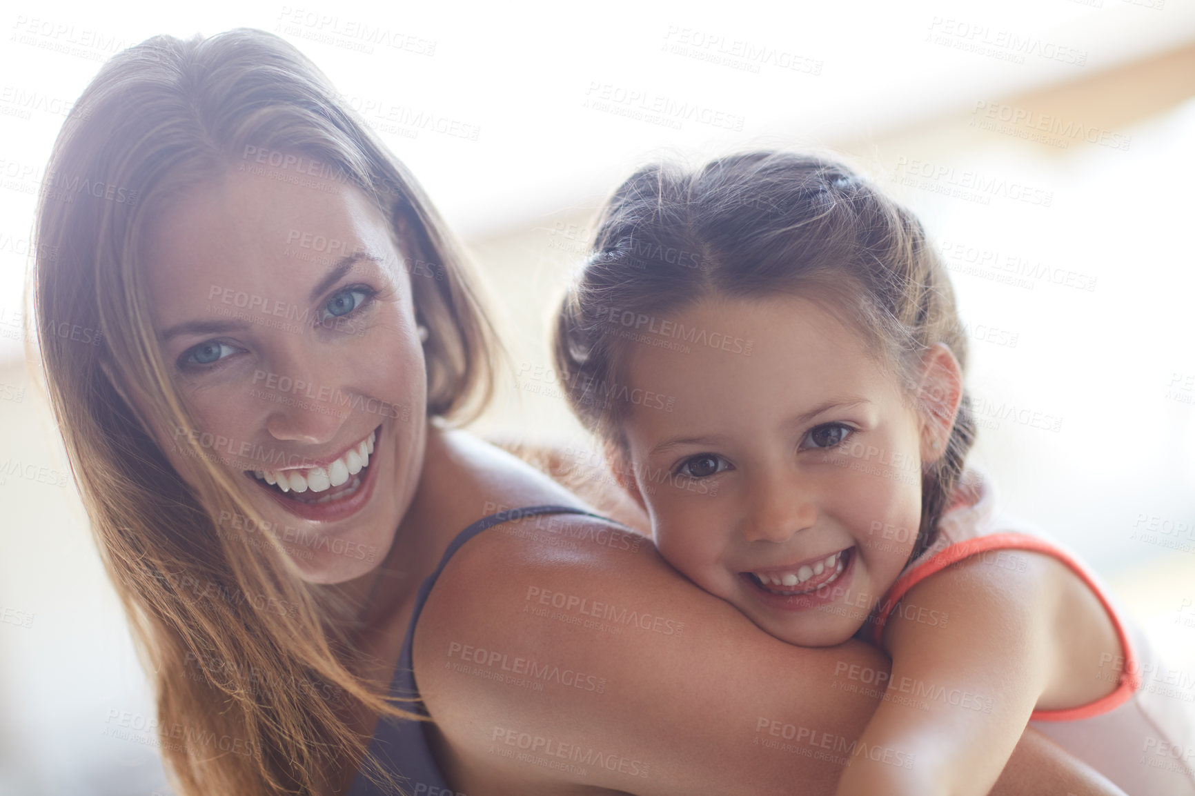 Buy stock photo Cropped shot of a mother and daughter spending time together at home