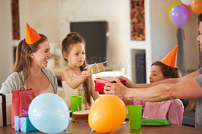 Buy stock photo Cropped shot of a family celebrating a birthday at home