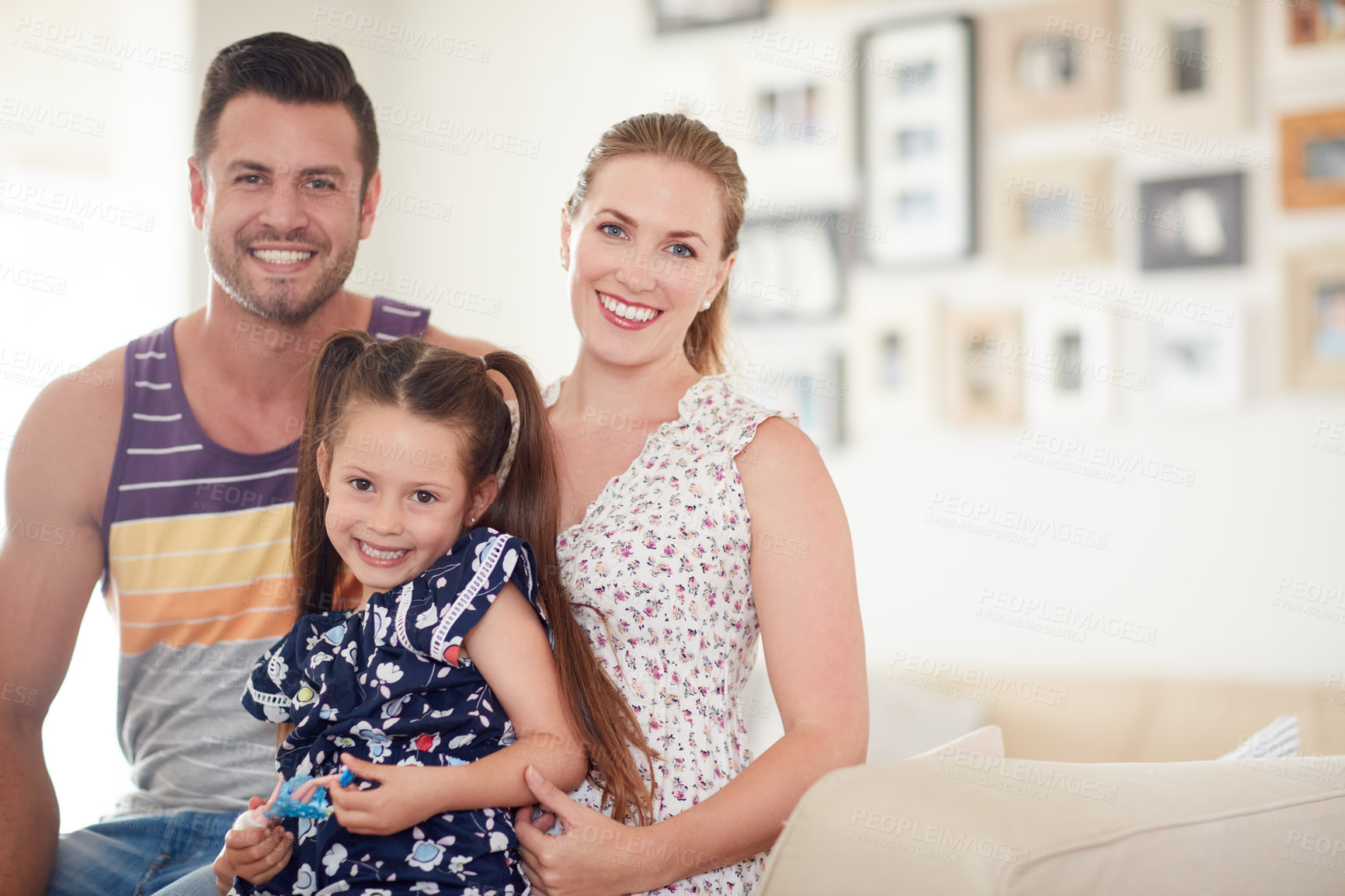Buy stock photo Shot of a family of three spending quality time together at home