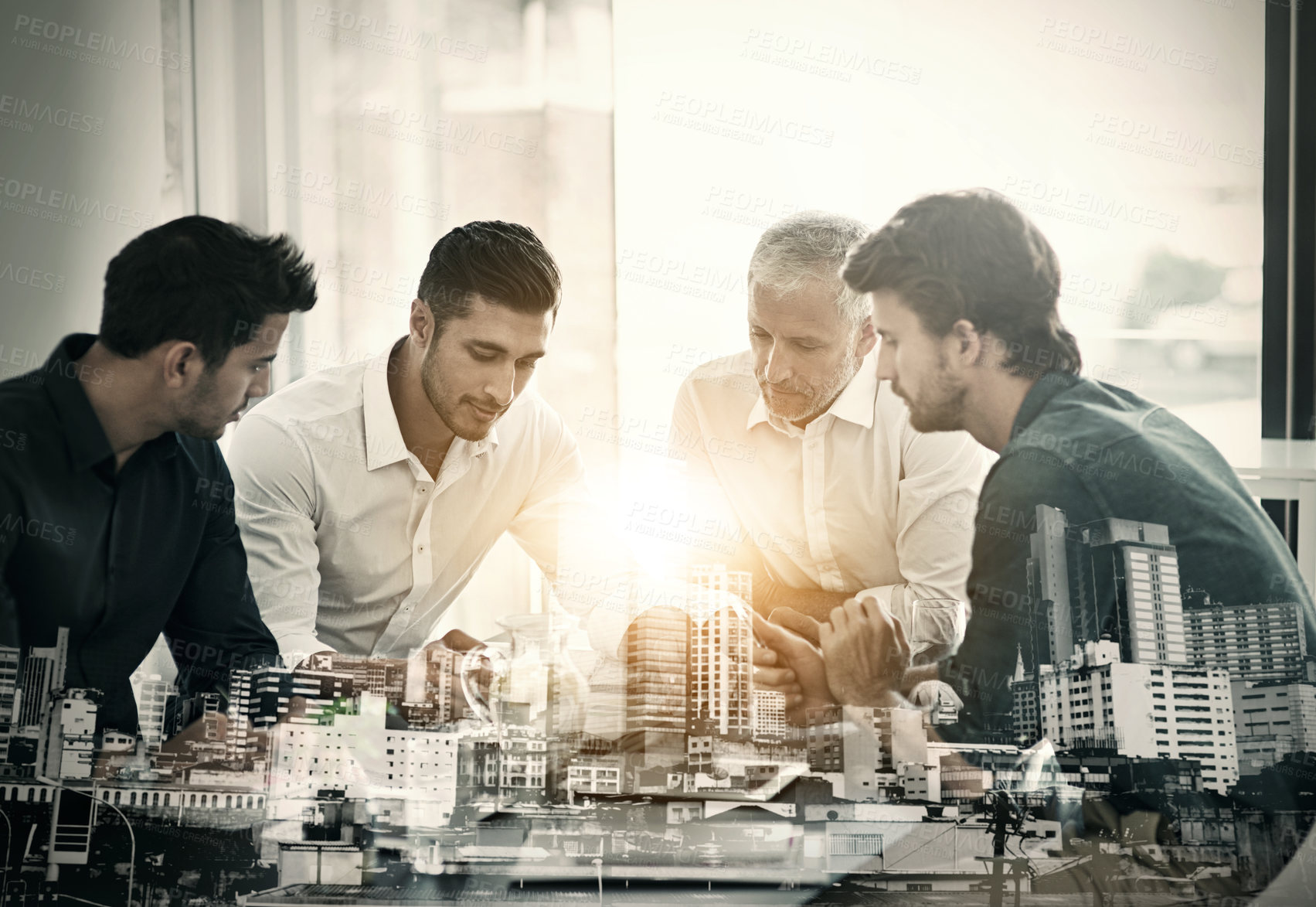 Buy stock photo Cropped shot of a group of businessmen having a meeting around a table in an office superimposed over a city background