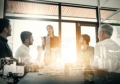 Buy stock photo Cropped shot of a businesswoman talking to her colleagues during a meeting in an boardroom superimposed over a city background