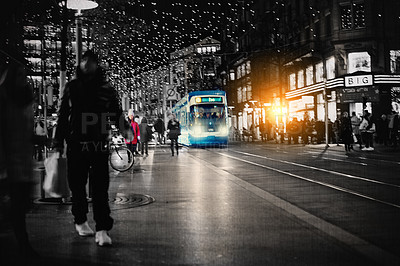 Buy stock photo Transport and travel at night. People walking on the sidewalk and a bus driving on the road. A late commute through the city. Digital enhanced street with flare and copy space. Sight seeing abroad