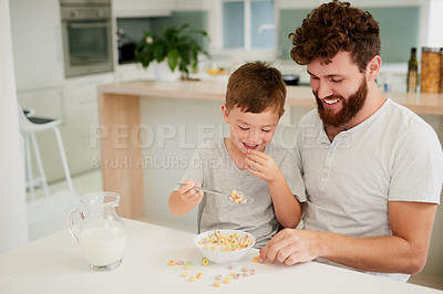 Buy stock photo Home, father and child with cereal for breakfast, nutrition benefits and eating for wellness with smile. Morning, dad and young boy with food for development, digestive health and milk for protein