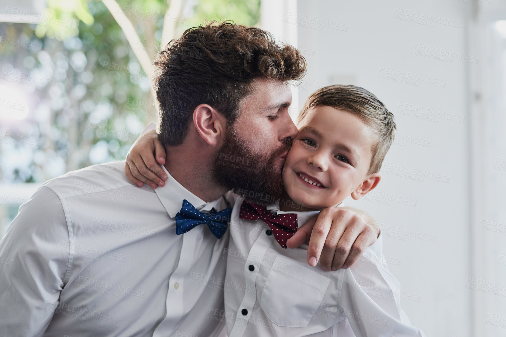 Buy stock photo Portrait of an adorable little boy and his father dressed in matching outfits at home