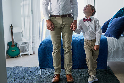 Buy stock photo Cropped shot of an adorable little boy and his unrecognizable father dressed in matching outfits