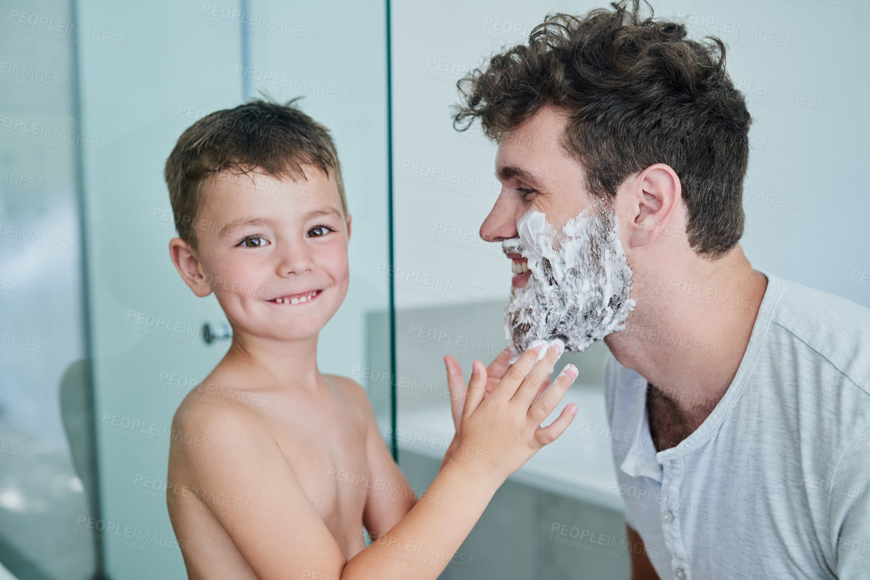 Buy stock photo Father, child and portrait while learning to shave in bathroom, having fun or bonding. Smile, kid help and dad with shaving cream on face, playing and cleaning, hygiene and enjoying time together.