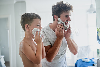 Buy stock photo Father, child and teaching how to shave in bathroom, having fun or bonding together. Smile, kid learning and dad shaving cream on face, playing and cleaning, hygiene and enjoying quality time in home