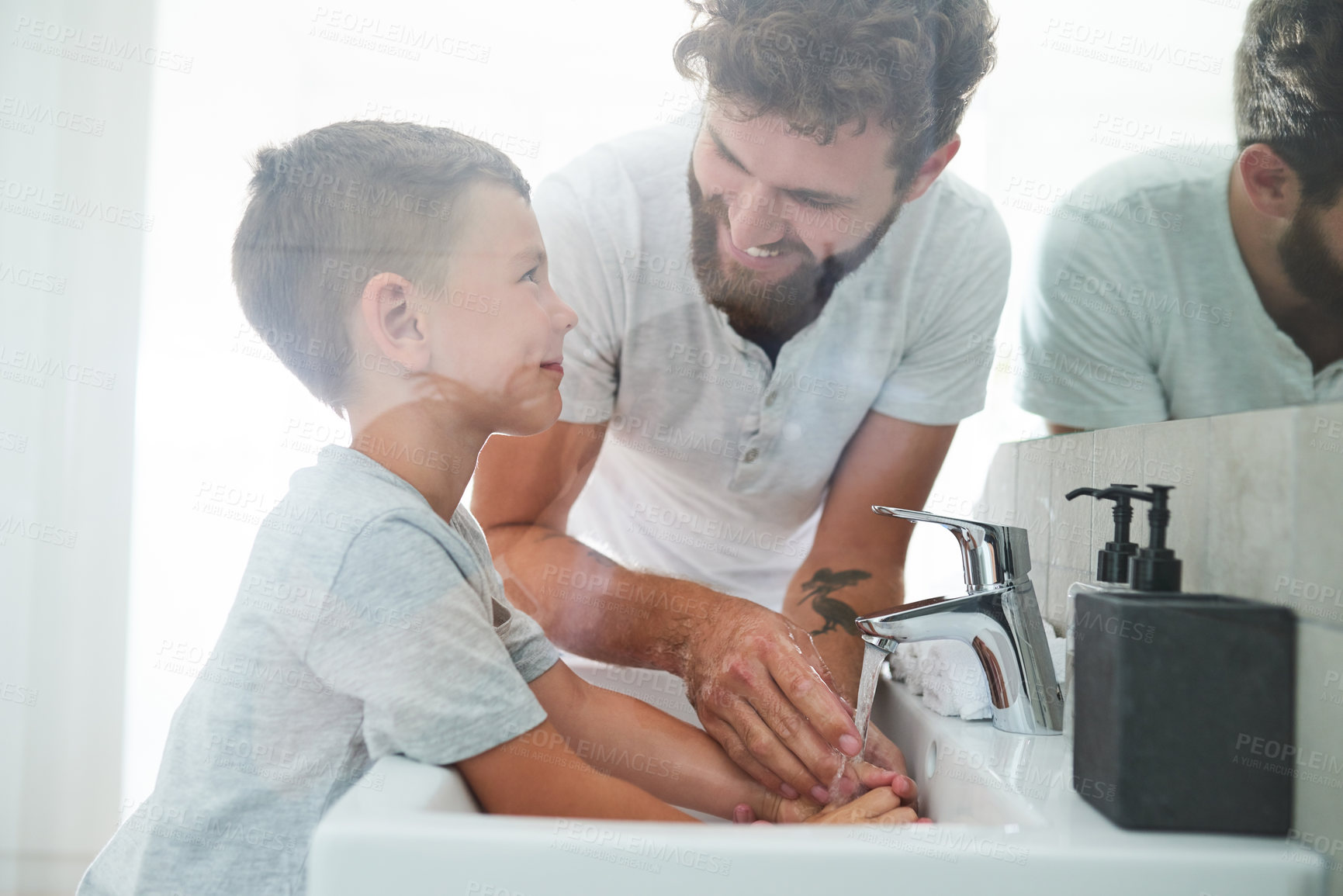 Buy stock photo Bathroom, father and child washing hands with soap, smile and teaching healthy hygiene in mirror. Cleaning, dirt and germs on fingers with happy boy, dad and morning wellness for skincare in home.