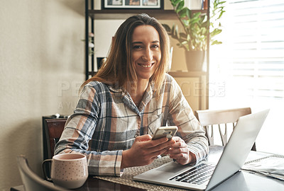 Buy stock photo Cropped shot of a young woman using a laptop in the morning at home