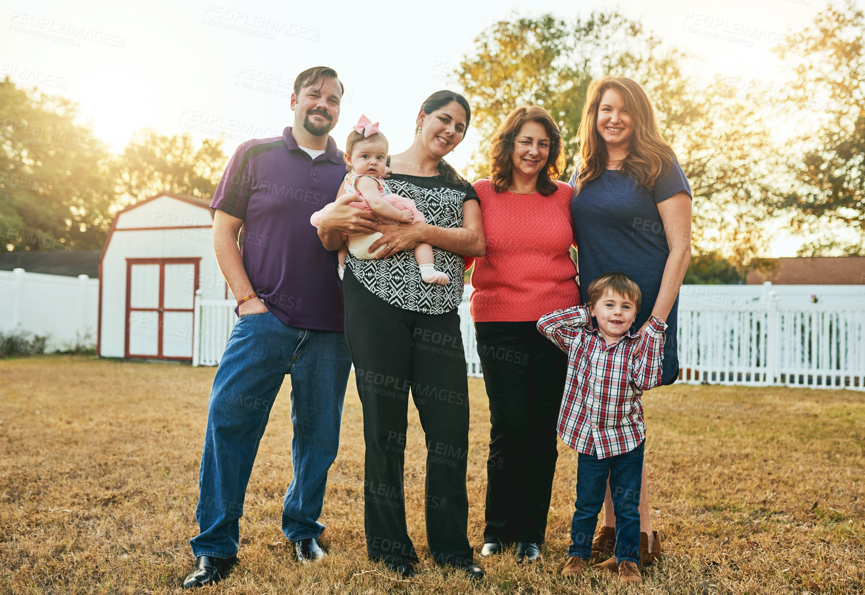 Buy stock photo Portrait of a happy family in the backyard at home