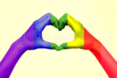Buy stock photo Cropped shot of an unrecognizable woman making a heart shape with her rainbow colored hands against a yellow background