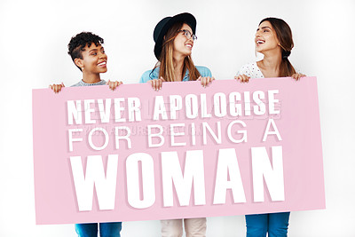 Buy stock photo Women, sign and board for feminism in studio, female rights and opinion on white background. Billboard, united people and words for awareness in solidarity, message and letters for gender equality