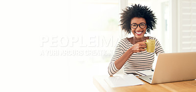 Buy stock photo Cropped portrait of a young woman drinking coffee while working on her laptop at home