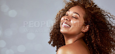 Buy stock photo Hair, space and African woman on banner with wind in studio for beauty, wellness and bokeh on grey background. Skincare, smile and happy model face with skin health, glow and relax with luxury mockup