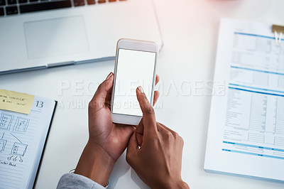 Buy stock photo Phone in the hands of a business woman for communication, networking and calling from above. Female corporate professional typing a text message while sitting at a desk in a modern office with flare