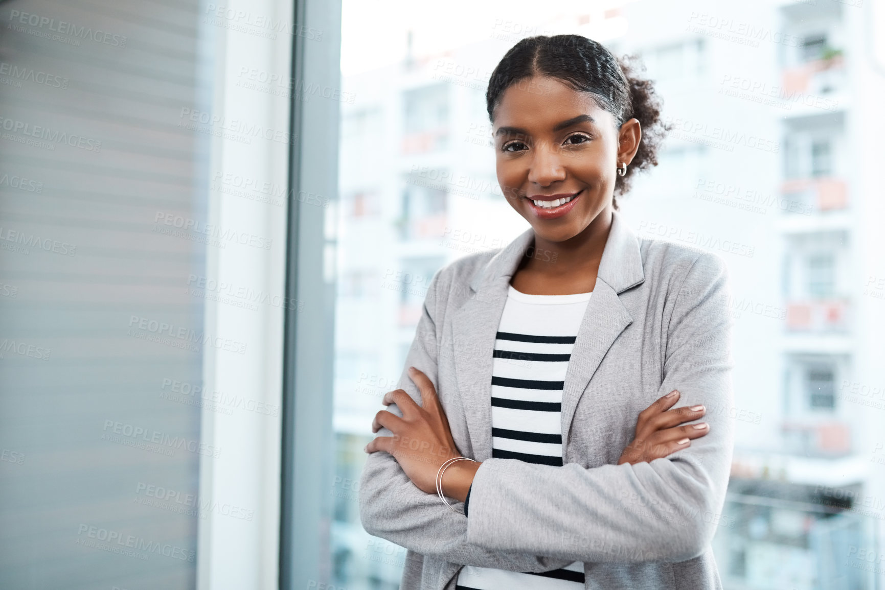 Buy stock photo Portrait of a confident young businesswoman working in a modern office