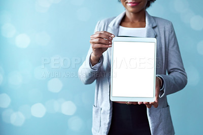 Buy stock photo Blank screen and copy space on a tablet screen for digital marketing and advertising. Closeup of female hands showing mobile device. A woman presenting technology and website against blue background