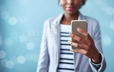 Buy stock photo Technology, phone and hand of a professional woman typing a message, browsing the internet or using mobile app. Closeup of female using technology and social media against bokeh copy space background