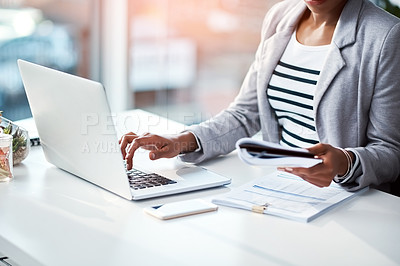 Buy stock photo Business woman typing on laptop, reading from notebook and planning a strategy in an office at work. Corporate employee, manager or boss sending emails, completing a proposal and browsing internet