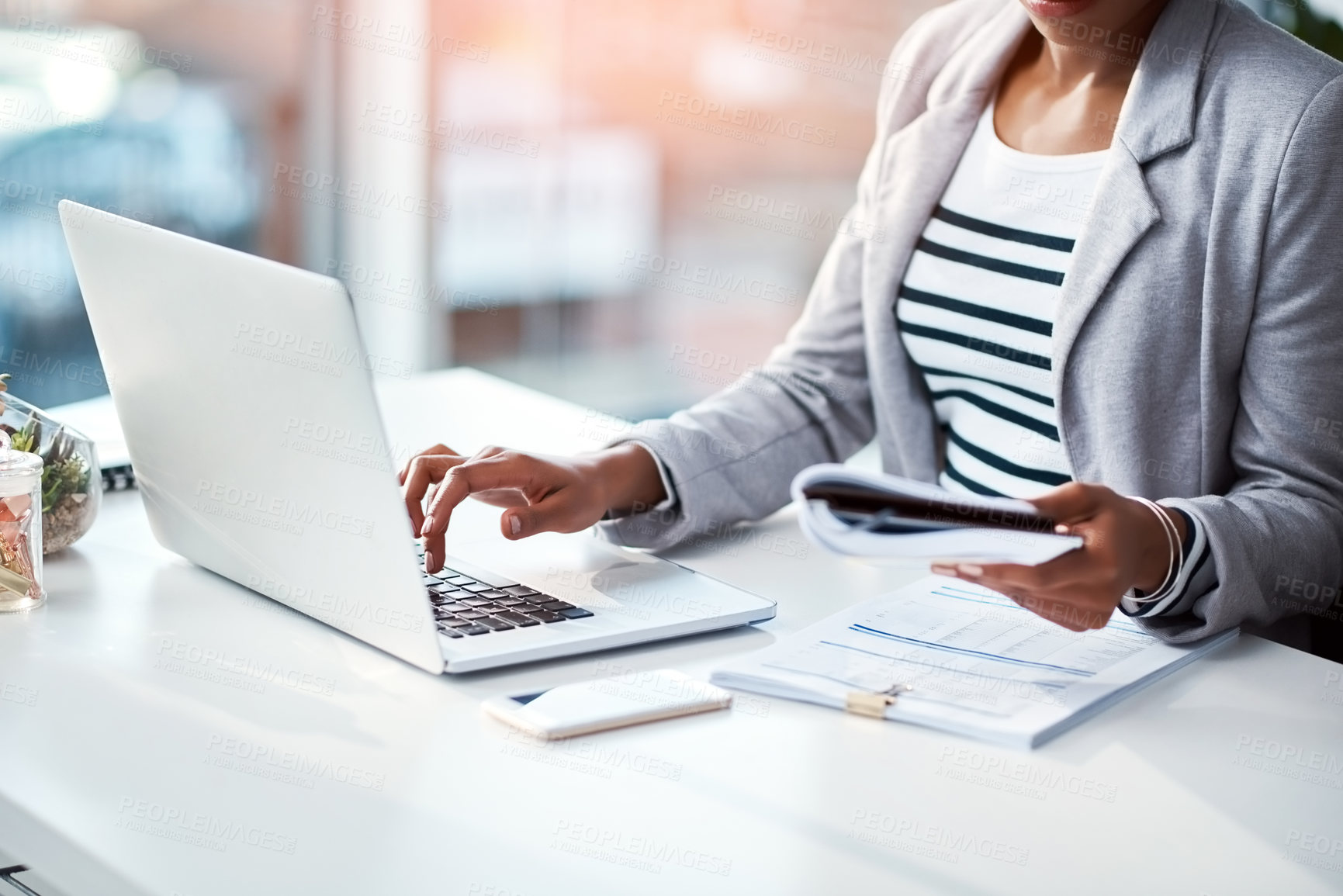 Buy stock photo Business woman typing on laptop, reading from notebook and planning a strategy in an office at work. Corporate employee, manager or boss sending emails, completing a proposal and browsing internet