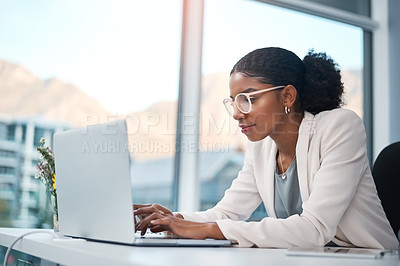 Buy stock photo Serious, confident or ambitious business woman thinking, planning and brainstorming idea. Creating entrepreneur typing on laptop, browsing and searching emails online on office technology. 