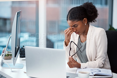Buy stock photo Female intern suffering from a headache or migraine due to stress caused by deadlines and work pressures. Professional in pain feeling bad, stressed and frustrated while busy on her computer desk