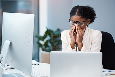 Buy stock photo Sad unhappy business woman with headache, migraine or burnout working on a computer in an office alone at work. One tired, anxious and frustrated corporate female boss looking exhausted and upset