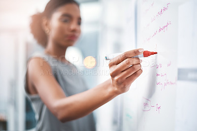 Buy stock photo Shot of a young businesswoman brainstorming on a whiteboard in modern office