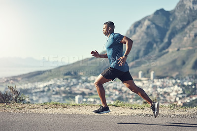 Buy stock photo Shot of a young handsome man running outdoors