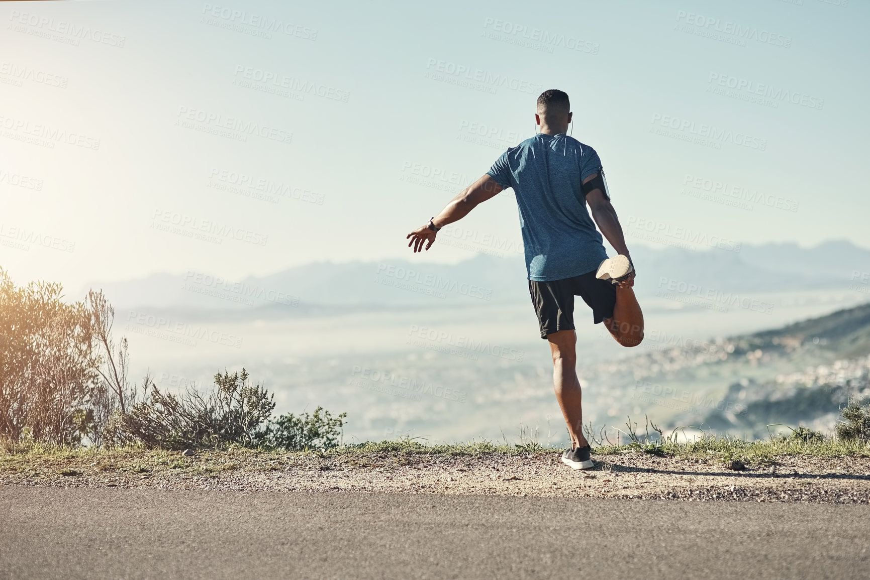 Buy stock photo Black man, stretching and outdoor for exercise, running and fitness with nature for upcoming athletic competition. Athlete, warm up and road for workout, jog and training with mountain top view