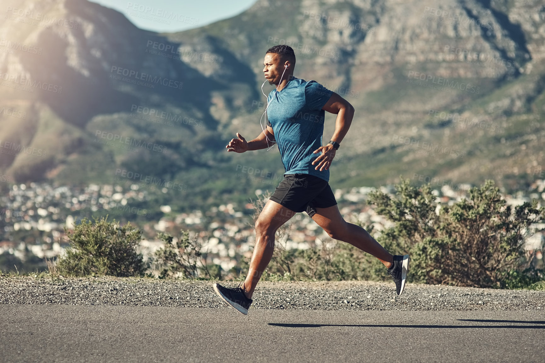 Buy stock photo Black man, running and outdoor with workout, exercise and motivation or training for future sports competition. Athlete, jog and road for fitness, health and performance with stopwatch or music