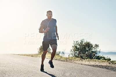 Buy stock photo Black man, running and road with fitness, exercise and motivation or training for future sports competition. Athlete, jog and outdoor for workout, health and performance with earphones or music