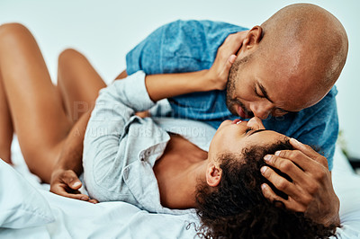 Buy stock photo Cropped shot of an affectionate young couple in their bedroom