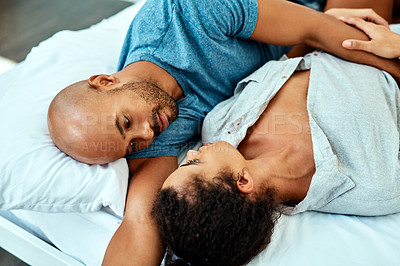 Buy stock photo Cropped shot of an affectionate young couple in their bedroom