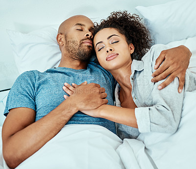 Buy stock photo Cropped shot of an affectionate young couple taking a nap together