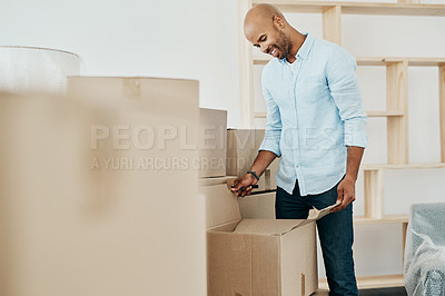 Buy stock photo Shot of a young man moving house
