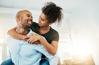 Buy stock photo Man, woman and piggy back in new house with smile, hug and excited for fresh start with property. African couple, happy and moving with boxes in apartment, real estate and investment with mortgage