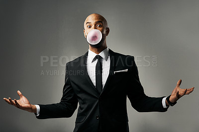 Buy stock photo Studio portrait of a handsome young businessman against a gray background