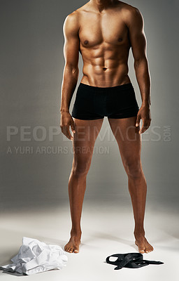 Buy stock photo Studio shot of a sexy unrecognizable man against a gray background in his underwear