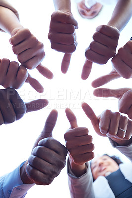 Buy stock photo Closeup shot of a group of unrecognizable businesspeople showing thumbs up outdoors